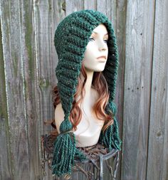 "Style: Bonnet style hood with fluffy oversized tassels. Color: This sample hat is shown in Kale ..green with tweed. You can choose from 34 colors. Please see the last photo in the listing and zoom in for a visual reference of your color choices, then select it from the drop down menu when ordering. Sizes: One size fits 20\" to 23\" (50.5 cm to 58 cm) head size. Fiber Content: 80% acrylic, 20% Wool Characteristics: Whimsical, very soft, warm and cozy. Care Instructions: Hand wash, dry flat. Ever Warm Yarn Crochet Hat With Ear Flaps, Bohemian Yarn Bonnet For Winter, Winter Bohemian Yarn Bonnet, Bohemian Winter Bonnet, Chunky Crochet Hat, Crochet Hood, Flap Hat, Visual Reference, Earflap Hat