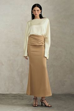 Indulge in luxury with our skirt. The trumpet high waist design accentuates your curves while the ankle length silhouette adds an air of sophistication. Made with premium silk, this skirt will elevate any outfit and make you feel like a work of art. Chic Satin Maxi Skirt For Work, Elegant Silk Wedding Bottoms, Elegant Fitted Maxi Skirt For Formal Occasions, Elegant Formal Fitted Maxi Skirt, Elegant Fitted Lined Maxi Skirt, Elegant Fitted Maxi Skirt With Lining, Satin Maxi Skirt For Workwear, Elegant Fitted Maxi Skirt With Lined Skirt, Elegant Floor-length Satin Skirt