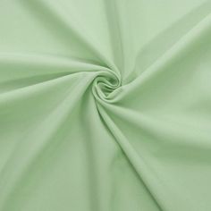 a close up shot of a light green fabric