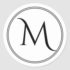 the letter m in a black and white circle