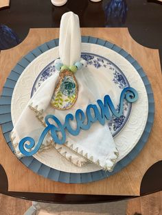 a decorated plate with the word macaroni on it and napkins in front of it