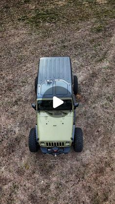 an off - road vehicle parked in the middle of a field