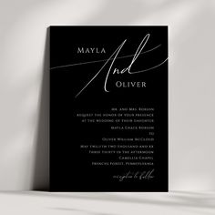 a black and white wedding card with the words, mayla and oliver on it