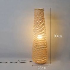 an image of a lamp that is on the wall with measurements for it to be read