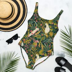 BOHEMIAN TROPICS One-Piece Swimsuit for Ladies, Tropical Parrots Swimming Suit, Floral Cockatoo Bathing Suit, Toucan Palm Leaves Swimsuit, Mystical Jungles Bathing Suit, Beach Outfit, Travel Gift Idea Prepare to be complimented! This Tropical Jungle one-piece swimsuit for all figures will bring out your best features. Enjoy the smooth fabric and the flattering design, and show it off by the sea or pool! Don't blame yourself for being so beautiful and proudly stay out of a crowd!  This Floral Par Cheap Tropical Style Bodysuit For Vacation, Cheap Women's Tropical Swimwear, Cheap Tropical Bodysuit For The Beach, Affordable Tropical Bodysuit For Beach, Cheap Tropical Bodysuit For Beach, Affordable Casual Tropical Print Swimwear, Cheap Tropical Print Swimwear For Summer, Cheap Tropical Fitted Swimwear, Cheap Tropical Floral Print Swimwear