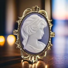 The Vintage Blue Cameo Brooch signed by Gerrys is a stunning piece of jewelry that beautifully encapsulates the timeless elegance of cameo design. Crafted with meticulous detail, it features a delicate blue and white color palette that captures the eye and evokes a sense of nostalgia. The intricate silhouette of a classical figure set against the blue background adds a touch of romance and sophistication, making this brooch not just a piece of jewelry but a genuine work of art. The gold tone of the brooch enhances its vintage charm, while the designer's signature serves as a hallmark of quality and authenticity. Gerrys, known for their exquisite craftsmanship, has created a brooch that can effortlessly elevate any outfit, whether it's paired with a casual ensemble or worn as a statement pi Blue And White Color Palette, White Color Palette, Rustic Bathroom Designs, Vintage Blue And White, Cameo Jewelry, Vintage Cameo, Cameo Brooch, Rustic Bathroom, Bathroom Designs