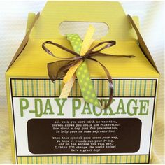 a yellow box with a green ribbon tied around the top and bottom that says p - pay package