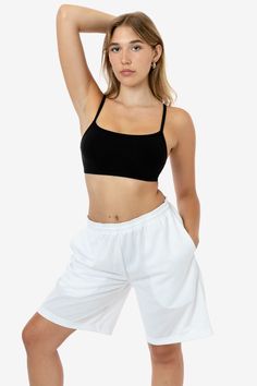 These long basketball-style shorts are made of a durable polyester mesh that lets just enough light through to give a sexy edge to this masculine garment. These shorts are very oversized, and we recommend women wear them low waisted with your favorite crop top. Features 2 side pockets and an adjustable drawcord waist. This garment is unisex, and women may want to take one size smaller than their usual size. Made in Los Angeles, Calif. Our experienced seamstresses earn an average up to $20 an hou Long Denim Shorts Outfit, Long Denim Shorts, Basketball Style, Denim Shorts Outfit, Style Shorts, Columbia Blue, Low Waisted, Long Shorts, Printed Blouse