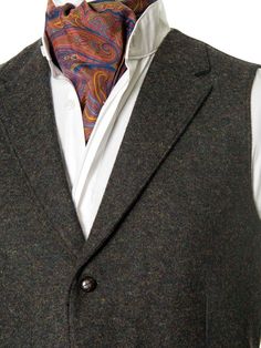 It's timeless quality makes this Irish tweed waistcoat well worth investing in if you have a penchant for classic Irish Design. This handmade tweed vest has an earthy tonal composition making it perfect for both day and evening events. The traditional herringbone peat colored tweed contains flecks of green and brown, for an immediate feel of the Irish landscape. Cut with quirky design details, it has been designed with a nod to Irish historical events. This fabric champions versatility offering Tweed Business Vest For Fall, Business Tweed Vest For Fall, Fall Business Tweed Vest, Business Tailored Tweed Vest, Formal Tweed Vest For Winter, Formal Winter Tweed Vest, Winter Business Tweed Vest, Formal Brown Tweed Vest, Tailored Classic Tweed Vest