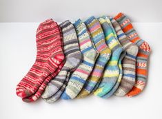 These wool thick colorful warm winter socks is a great addition to any wardrobe during the colder months. Wool is a natural material that is known for its ability to insulate and keep feet warm, even in very cold temperatures. The thick fabric of these socks will provide extra warmth and cushioning, while the colorful design is sure to add a fun touch to any outfit. These socks are ideal for wearing with boots or other closed-toe shoes to keep your feet cozy and comfortable all winter long. Mate Warm Cozy Multicolor Socks, Cozy Warm Multicolor Socks, Warm Multicolor Socks, Comfortable Warm Multicolor Socks, Comfortable Knitted Winter Socks, Warm Comfortable Socks For Cold Weather, Comfortable Warm Socks For Cold Weather, Warm Multicolor Socks For Winter, Comfortable Hand Knitted Winter Socks