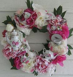 a wreath made out of flowers and lace