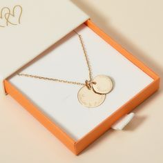 Celebrate love and connection through generations with our Personalised Grandmother Necklace. A special token to represent family and the cherished memories between a grandmother and her grandchildren, each necklace features two smooth discs to engrave with the names and dates she holds closest to her heart.&nbsp;18K Champagne Gold Plated, 925 Sterling Silver or 18K Rose Gold PlatedCharms measure: 1.5 x 1.5cm (Small Flat Disc), 1.9 x 1.9cm (Medium Flat Disc)Secure clasp fasteningCharms are r Silver Medallion Necklace For Anniversary, Round Pendant Necklace With Charms For Anniversary Gift, Round Pendant Necklace With Charms For Anniversary, Mother's Day Coin Pendant Necklace, Anniversary Necklace With Initials On Round Disc, Engraved Round Disc Necklace As Gift For Mom, Personalized Coin Necklace With Round Pendant For Anniversary, Round Disc Necklace With Engraving Option For Anniversary, Grandmother Necklace