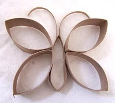 three pieces of cardboard are arranged in the shape of a flower