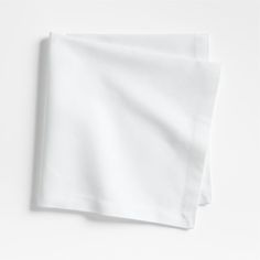 two white napkins sitting on top of each other