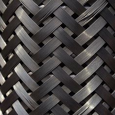 a close up view of an iron woven basket weaved into the shape of a heart