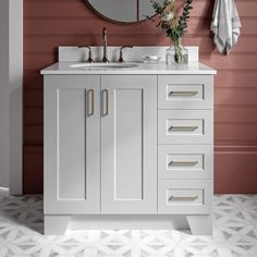 a bathroom vanity with two sinks and a mirror on the wall next to it,