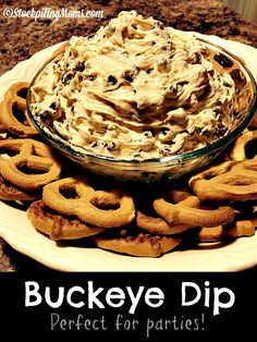 a bowl of dip surrounded by pretzels on a plate with the words buckeye dip perfect for parties