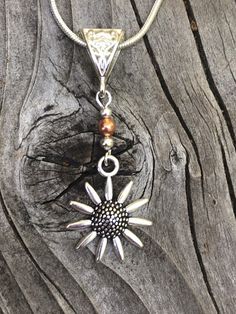 Silver and copper Boho sunflower necklace set. This bright and lightweight sunflower and copper necklace set will go with everything! The perfect summer Jewelry. The earrings are one and a half inches long and 3/4 of an inch wide. They are silver and copper and the French ear wires are sterling silver. The pendant is 2 inches tall and 3/4 of an inch wide and comes with a sterling silver snake chain. All my jewelry comes gift boxed with a custom Shelly Mariposa Design butterfly card ready for gif Bohemian Sunflower Design Jewelry As Gift, Adjustable Silver Copper Jewelry, Spiritual Silver Jewelry In Copper, Bohemian Copper Necklace In Silver Color, Adjustable Silver Copper Necklace, Bohemian Silver Necklace With Copper, Adjustable Copper Silver Necklace, Bohemian Silver Necklace In Copper, Bohemian Sunflower Jewelry As Gift