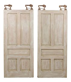 two wooden doors with handles on each side