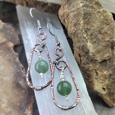 Stunning Green Aventurine Textured Copper Earrings, made with Textured Copper and Silver Wire. The perfect addition to your jewelry collection!  Great Energy These earrings are made with Beautiful Green Aventurine Gemstone beads, known for their calming and soothing energy.  Featuring a simple yet elegant design, these earrings are carefully hand crafted with copper and silver wire, textured and oxidized to give this unique look! They are lightweight and comfortable to wear all day long. You can Handmade Oval Jade Earrings, Unique Handcrafted Jewelry, Oval Hoop Earrings, Oxidized Copper, Earring Designs, Earring Ideas, Wrapped Jewelry, Wire Work, Copper Earrings