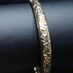 *Description: This is a great Whiting & Davis embossed gold tone floral bangle bracelet from the late 1960s to 1970s. The bracelet is in great condition and is signed on the inside of the bangle. This would be a great vintage bangle bracelet for your collection of Whiting & Davis and would also make a great gift. It would be the perfect bracelet to layer with other bangles. It is an over the hand bracelet, no clasp. *Approximate Measurements: Length - 7 1/2 Inches, Width - 1/4 Inch *Cond Amp Davis, Bangle Bracelet Gold, Formal Earrings, Vintage Bangle Bracelets, Vintage Christmas Gifts, Book Pieces, Late 1960s, Vintage Bangles, Hand Bracelet