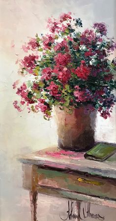 a painting of pink flowers in a pot on a table with a book and pen