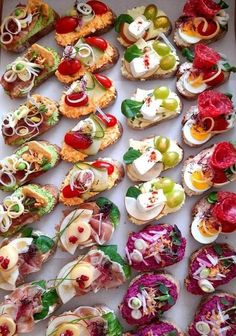 an assortment of appetizers are displayed in a box