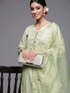 Product Details Olive green embroidered Kurta with Trousers with dupatta Kurta design:  * Ethnic motifs embroidered * Straight shape Regular style Round neck, three-quarter regular sleeves * Mirror work detail * Calf length with straight hem * Cotton blend fabric Trousers design:  * Solid Trousers * Partially elasticated waistband * Slip-on closure Material & Care Cotton Blend Organza Machine Wash Items Includes One piece kurta One piece Dupatta One piece Trouser Note:- Please see the size chart in the image to choose a perfect size. Please feel free to ask any questions regarding this item WE ALSO ACCEPT CUSTOMISATION AS PER CUSTOMER REQUESTS. Festive Green Kurta With Floral Embroidery, Green Sharara With Floral Embroidery, Green Sharara With Resham Embroidery For Spring, Elegant Pista Green Kurta With Floral Embroidery, Green Resham Embroidery Sharara For Spring, Spring Green Sharara With Resham Embroidery, Green Resham Embroidered Sharara For Spring, Pista Green Sharara With Floral Embroidery For Spring, Green Floral Embroidered Sharara