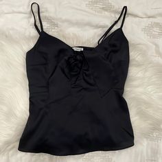 Never Worn! Black Satin Cami. Cute Now In The Front. Elastic Waist In Back Makes It Comfortable. Elegant Black Tank Top For Date Night, Chic Black Camisole, Black Cami Top For Evening, Chic Black Camisole For Date Night, Black Coquette Tops For Party, Black Coquette Party Tops, Black Satin Spaghetti Strap Tank Top, Sleek Black Cami Top, Black Coquette Camisole Top