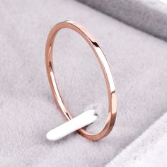 This Is A Brand New 1.2mm Wide Flat Wedding Band Made Out Of Rose Gold Plated Titanium. The Finished Weight Of The Ring Is 1 Gram. R0122 - 5 R0123 - 6 R0124 - 7 R0203 - 8 R0204 - 9 R0205 - 10 R0206 - 11 Rose Gold Stackable Rings, Rose Gold Wedding Band, Couple Wedding Rings, 1 Rose, Couple Wedding, Gold Ring Stack, Rose Gold Band, Rose Gold Wedding, Minimalist Rings