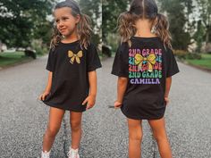 Get ready for the first day of second grade with our Personalized Second Grade Back to School Shirt! 🎒🌟 Make the start of the school year extra special with this adorable and customizable shirt, designed to celebrate your little one's big milestone. Perfect for first day photos, classroom adventures, and new friendships, this shirt is a delightful way to kick off the school year! 🍎 Cute and Comfy Design: Crafted from soft, breathable fabric, this shirt ensures your second grader stays comfort Spirit Jeans, Dance Instructor, Comfort Colors Tee, Girls Birthday, Birthday Shirt, Kids Tops, Oversized Shirt, Dye T Shirt, Orchestra