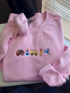 The cutest teacher embroidered sweatshirt! Cute Long Sleeve Sweatshirt For School, Spring Cotton Sweatshirt With School Spirit, Long Sleeve School Tops With Embroidered Text, Spring School Spirit Cotton Sweatshirt, Cute Cotton School Sweater, Cute Cotton Sweater For School, Cute Long Sleeve Sweatshirt For Everyday, Fall School Tops With Embroidered Logo, Fall School Tops With Embroidery