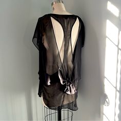 Nwot Never Worn Nameless Sheer Black Polyester Fabric Bow Or Tie In The Back Cut Outs In Back Size Medium Black Sheer Beach Top, Chic Black Top For Daywear, Black Summer Blouse For Layering, Sheer Back Tops For Night Out In Summer, Sheer Back Top For Night Out In Summer, Summer Tops With Sheer Back For Night Out, Black Top With Sheer Back For Night Out, Summer Black Daywear Tops, Black Polyester Fabric