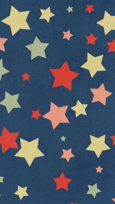 a blue background with red, yellow and green stars