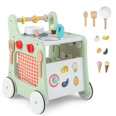 a toy kitchen with wooden utensils and spoons on the side, including an ice cream maker