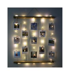 a wall hanging with lights and pictures on it