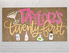 a sign that says taylor's twenty first with bottles and confetti on it