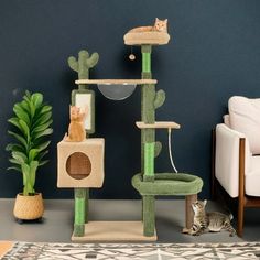 a cat sitting on top of a green scratching tower next to a white chair and potted plant