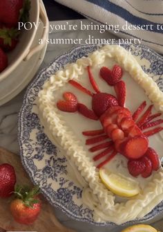 a cake decorated with strawberries and lemon slices