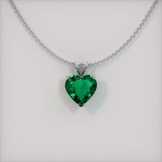 The pendant is entirely set in 18K white gold. The pendant features a beautiful, transparent 1.98 carat heart shape green emerald with the dimensions of 8.97 x 9.23 x 4.36 mm and a mixed brilliant cut. It has a clarity grade of slightly included (evaluated at eye level), vivid color saturation, and an excellent polish. The origin of this emerald is Zambia. #gift necklace #beautiful necklaces #necklace for her #accessories necklaces #necklace cute Luxury Emerald Necklace With Vvs Clarity As A Gift, Luxury Vvs Clarity Emerald Necklace As Gift, Emerald Pendant Necklace Zales, Luxury Exquisite Emerald Necklace For Gift, Luxury Teardrop Pendant Emerald Necklace, Luxury Formal Emerald Pendant Necklace, Luxury Faceted Emerald Necklace As Gift, Luxury Emerald Round Pendant Necklace, Luxury Hallmarked Emerald Pendant Necklace