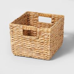 an empty basket with handles on a white background