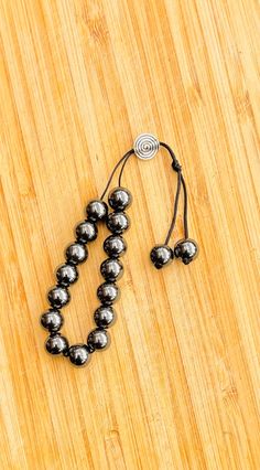 Hematite Greek Komboloi worry beads.  **Hematite** A pleasant weight in the hand, and shot through with metallic shades of silver.  Worry beads or komboloi/kompoloi (Greek: κομπολόι, IPA: [ko(m)boˈloi̯], 'bead collection'; plural: κομπολόγια, IPA: [ko(m)boˈloʝa]) is a string of beads manipulated with one or two hands and used to pass time in Greek and Cypriot culture.  Unlike the similar prayer beads used in many religious traditions, worry beads have no religious or ceremonial purpose. A unique Cypriot Culture, Shades Of Silver, Worry Beads, Bead Collection, Prayer Beads, Ipa, Two Hands, No Worries, Meditation