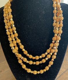 "Vintage Crown Trifari 1962 Electra textured gold parure Necklace Bracelet and Earrings set Excellent condition Necklace measures: 17\" Bracelet = 7 1/2\" Earrings= L = 1 1/4\" W = 3/4\"" Gold Necklace With Gold Beads For Evening, Antique Gold Jewelry For Party, Vintage Gold Beads Jewelry For Party, Vintage Gold Beaded Jewelry For Parties, Vintage Gold Jewelry For Festive Occasion, Vintage Gold Beaded Party Jewelry, Vintage Gold Jewelry With Gold Beads, Vintage Gold Beaded Jewelry, Vintage Gold Beads Jewelry For Formal Events