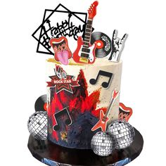 a cake decorated with musical instruments and disco balls