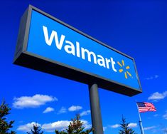 a walmart sign with an american flag in the background