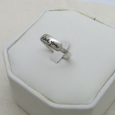 "This sterling silver handwriting ring is personalized with your ACTUAL handwriting. The handwriting is deeply engraved and the engraving is blackened to bring out the detail. Handmade using sterling silver, the handwriting layer will measure approx. 3/16\" and the length will be based on your handwriting. I don't recommend anything longer than 5/8\", especially on size 7 or smaller rings. The ring shank is approx. 1/8\" (4mm) wide and is approx. 1.5mm thick. Please send your handwriting image b Promise Sterling Silver Ring With Engraved Text, Sterling Silver Promise Ring With Engraved Text, Promise Sterling Silver Engraved Ring, Meaningful Sterling Silver Rings With Engraving Option, Hand Stamped Sterling Silver Engraved Ring As Gift, Hand Stamped Sterling Silver Engraved Ring, Sterling Silver Rings With Engraved Text For Anniversary, Classic Sterling Silver Hand Stamped Engraved Ring, Sterling Silver Stamped Signet Ring For Wedding