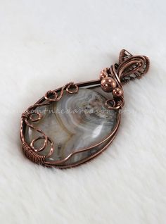 D E T A I L S Experience the magic of artisanal jewelry with this gorgeous crazy lace agate pendant wrapped in copper wire. Each piece tells a story of skill, passion, and the beauty found in nature. Crafted with care and attention to detail, this unique piece is a testament to the enduring allure of artisanal craftsmanship. The pendant is finished by oxidizing it to give it a beautiful antique/patina look and polished back out to bring out all the details of the wire work. You will receive the exact pendant in the photo as I cannot re-produce the exact same pendant twice since all gemstones are different and unique. You will also receive your pendant in a complimentary gift box along with an 18" black waxed cord necklace with stainless steel clasp, (1) polishing pad and (1) small plastic Pinterest Shop, Stackable Beaded Bracelets, Oxidized Copper, Necklace Unique, Agate Necklace, Crazy Lace Agate, Wire Work, Agate Pendant, Cord Necklace