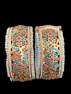 bangles made using high quality jadau pearls with ruby and emerald stones 22 carat goldplated Jadau Bangles, Pearl Chain Necklace, Hand Wrist, 22 Carat Gold, Bangles Making, Silver Jewelry Earrings, Silver Jewelry Pendant, Jewelry Design Necklace, Emerald Stone