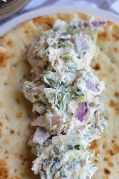 there is a pita bread with chicken salad on it