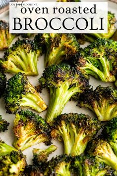 broccoli florets on a plate with the words oven roasted broccoli